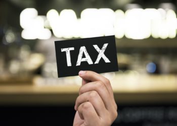 Closeup of hand holding black paper card
