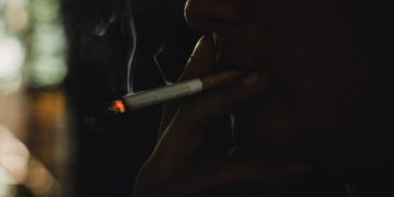 New english cohort study: fewer Covid-19 hospitalization among smokers and studies on the role of nicotine